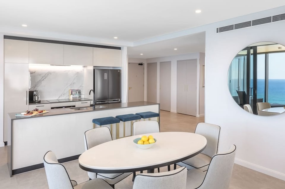 Kitchen and ocean-view dining area in a Gold Coast serviced apartment