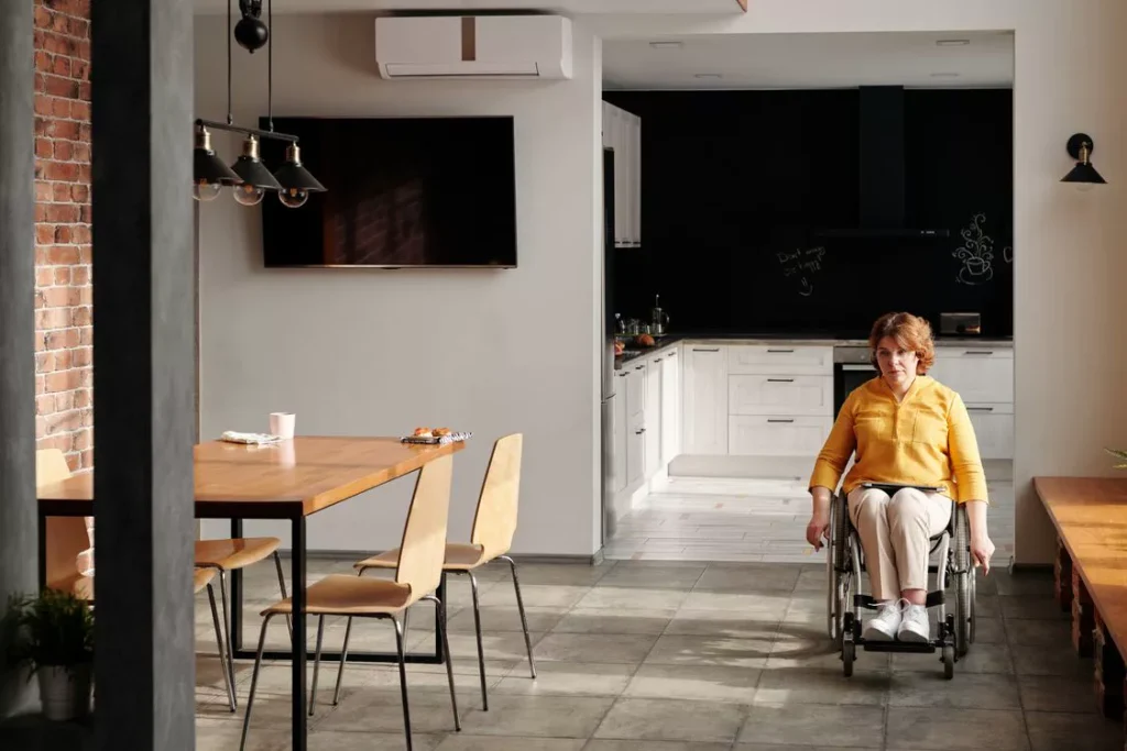 Wheelchair user in accessible accommodation during an NDIS short-term respite stay on the Gold Coast